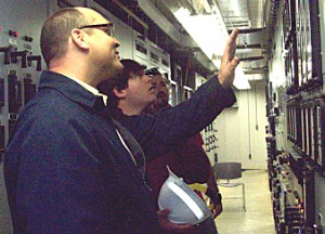 Kevin Norris explains how electro-mechanical relays works at McAdams transmission substation.